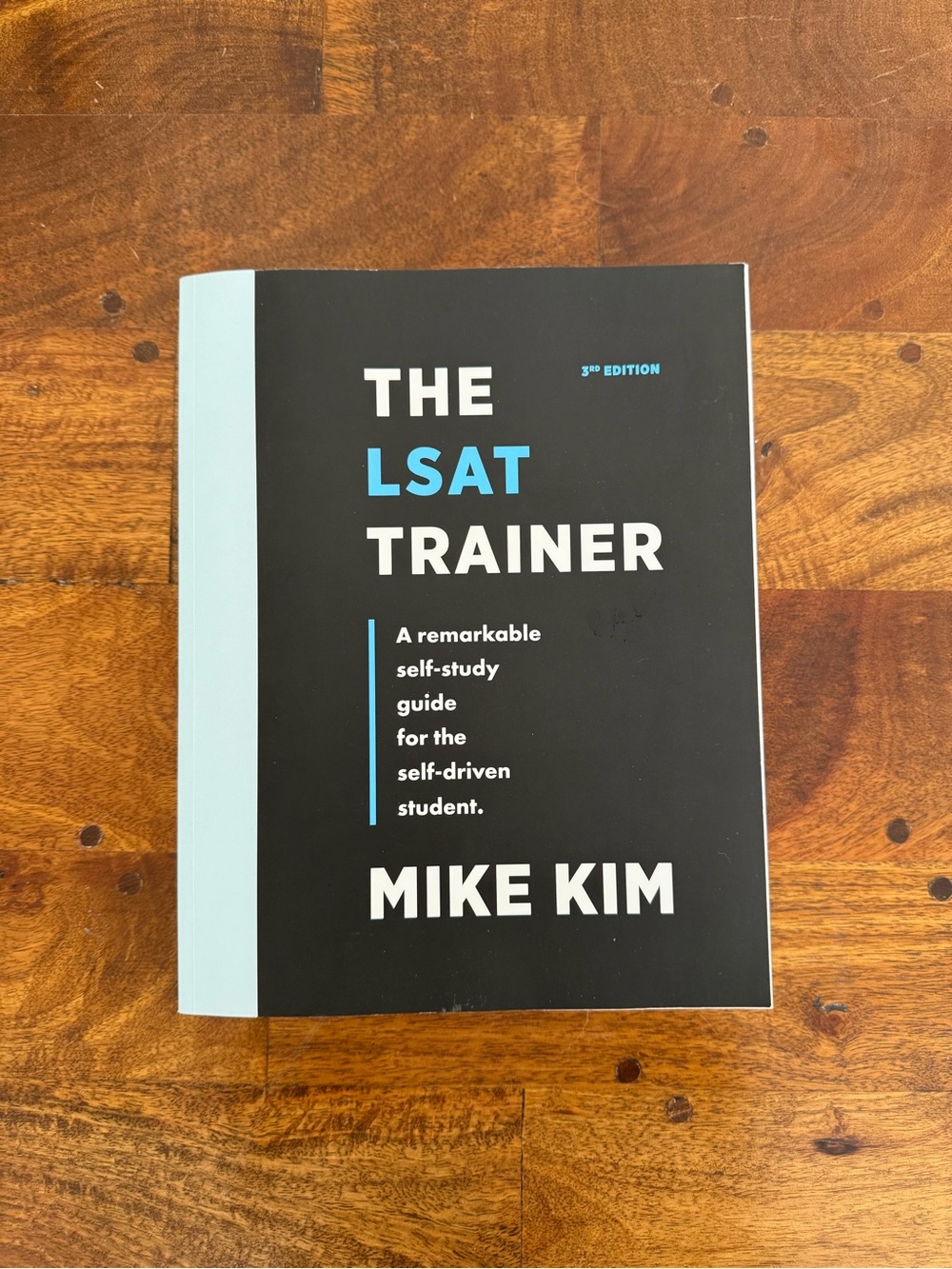The LSAT Trainer by - Black and Light Blue Cover